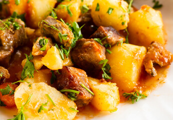 traditionally Russian dish of stewed potatoes with meat. Zharkoe po domashnemu