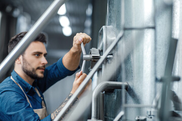 Fototapeta na wymiar Equipment control in brewery and drink industrial