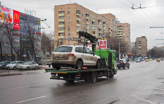 March 10, 2019 Moscow, Russia. A passenger car is taken away by a tow truck due to a violation of Parking rules on a street in Moscow.