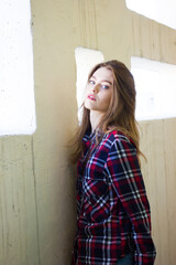 portrait of a young woman in shirt . Girl with blue eyes and red lips