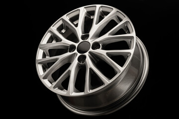 new grey silver alloy wheel on black background