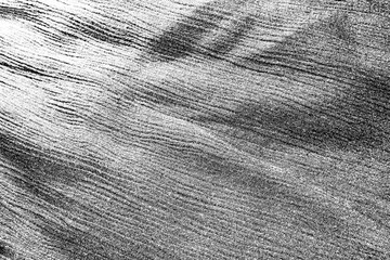 Obraz premium Light black gray one-color monochromatic rough fabric, textile with folds. Dust, threads glitters on fabrics, on clothes.