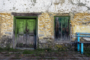 Fototapeta na wymiar Old door and window on the old wall brick