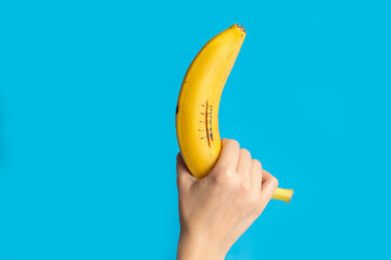 Creative concepts, banana in hand with a seam