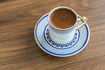 Traditional turkish coffee on wood background. Closeup turkish coffee on wood table