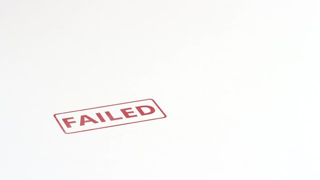FAILED red rubber stamp on the paper