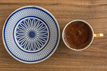 Traditional turkish coffee on wood background. Closeup turkish coffee on wood table