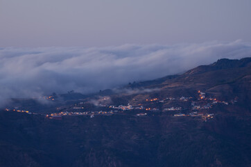 Town of Artenara at sunset and sea of clouds. The Nublo Rural Park. Gran Canaria. Canary Islands. Spain.