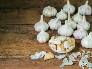 Garlic on old wooden backgorund.Food ingredient concept.