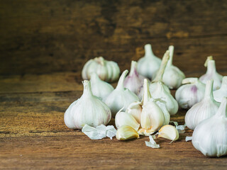 Garlic on old wooden backgorund.Food ingredient concept.
