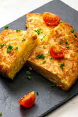 Spanish tortilla with tomatoes and chive