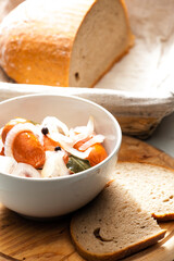 homemade pickled sausages with onion and bread