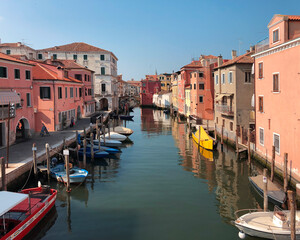 Obraz na płótnie Canvas beautiful street canal boats in Chioggia