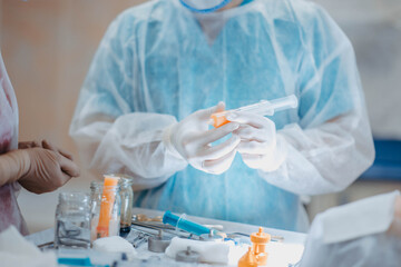 preparation of fat cells for lipofilling in the operating room. Surgical cosmetic surgery to...