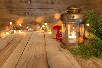 festive decoration with glowing lantern on wooden background. copy space
