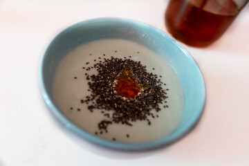 a breakfast bowl of yogurt with chia and honey 