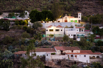 Fototapeta na wymiar Church and houses of the Juncal village at dawn. The Nublo Rural Park. Tejeda. Gran Canaria. Canary Islands. Spain.