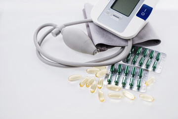 Fototapeta na wymiar Tonometer-device for measuring pressure, monitoring health at home, taking vitamins D, omega, minerals