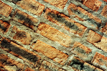 Destroyed red brick wall. Texture with cracks. Vintage style for design.