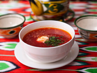 Borscht. Russian soup made from meat, beets, potatoes and served with sour cream. Asian style