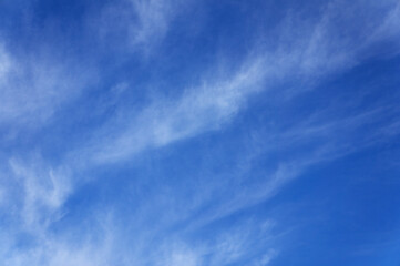 blue sky and lines of clouds