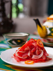  Salad of tomatoes and pickled onions according to the Uzbek recipe. Asian style
