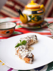 Salmon steak with creamy sauce and mushrooms with herbs. Asian style