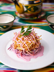  Capercaillie nest salad made of beets, pie potatoes, markovi and greens, topped with mayonnaise. Asian style