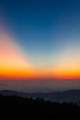 Fototapeta premium Beautiful landscape of sunrise at Noen Chang Suek peak at E-Thong village in Thong Pha Phum National Park, Kanchanaburi province, Thailand.