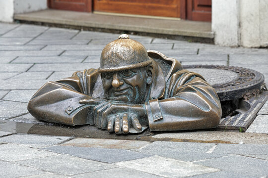 Cumil the Peeper sculpture, also known as The Watcher or Man at Work, in Bratislava, Slovakia