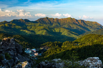 Fototapeta premium Beautiful landscape of E-Thong village and Chang Phuak Hill in the background in Thong Pha Phum National Park, Kanchanaburi, Thailand.