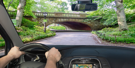 Driving a car in Central Park, Manhattan, New York, USA
