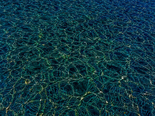 Abstract background of marbled surface pattern in iridescent blue-green color with whimsical close-up. High quality photo