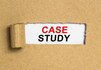The text CASE STUDY behind torn brown paper. Business Concept image