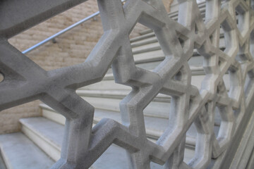 star-carved marble and staircase view