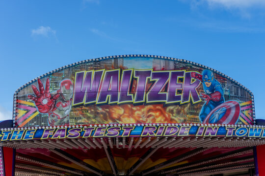 06/08/2019 Portsmouth, Hampshire, UK A waltzer fairground ride sign with lights
