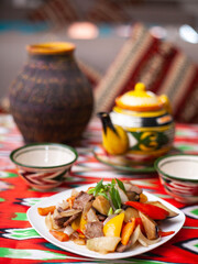  Fried beef meat in oil with potatoes, onions, bell peppers according to the Uyghur recipe