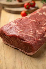 Raw Meat Sliced Pieces Of Beef With Spices And Herbs On A Wooden Board 