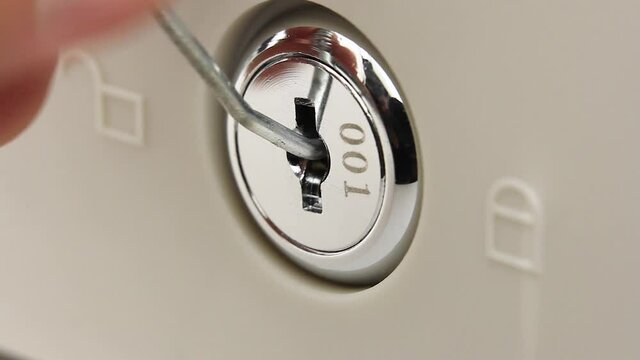 close-up view on larva of lock of safe or cash drawer, thief unsuccessfully tries to open lock with piece of wire or picklock, break in or hack security system, attempt to access secret data