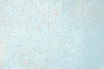 Gentle blue background. Oxidized metal texture with brass and aqua patina, rusty metal surface with rust streaks.