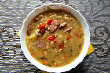 Traditional Russian soup solyanka closeup, view from above
