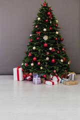 Christmas tree with gift decoration balls garlands new year interior