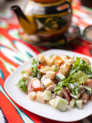 Tomato, cucumber, sweet pepper and onion salad, seasoned with oil. Asian style