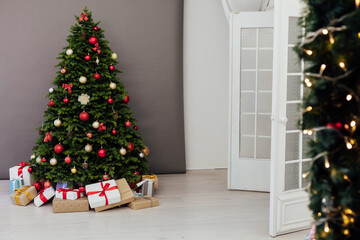 Christmas tree with gift decoration balls garlands new year interior