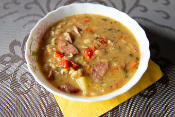 Traditional Russian soup solyanka closeup, view from above