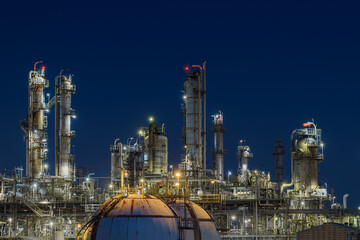 Glitter lighting of petrochemical plant at night, Manufacturing of Oil and gas refinery industrial, Close up of equipment petroleum industry - obrazy, fototapety, plakaty