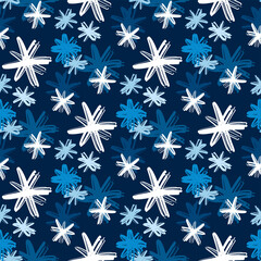 Beautiful white and bluish different ink snowflakes isolated on dark blue background. Cute Christmas seamless pattern. Vector flat graphic hand drawn illustration. Texture.