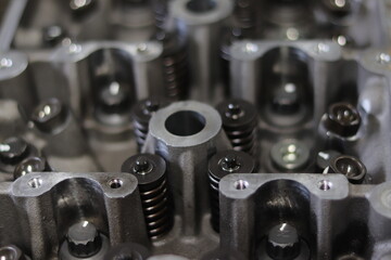 The mechanic is checking the engine.