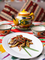  Eastern warm salad. Fried pieces of beef, marcovi and cucumbers in sauce and sesame seeds. Asian style