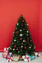 Christmas tree with gift decoration balls garlands new year interior